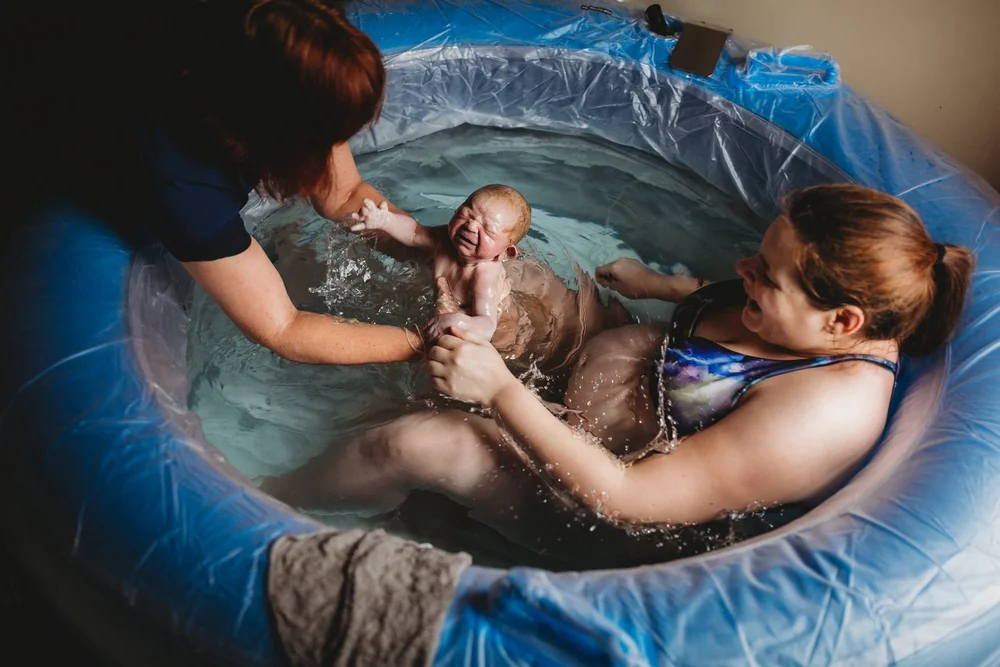 A midwife at a home visit